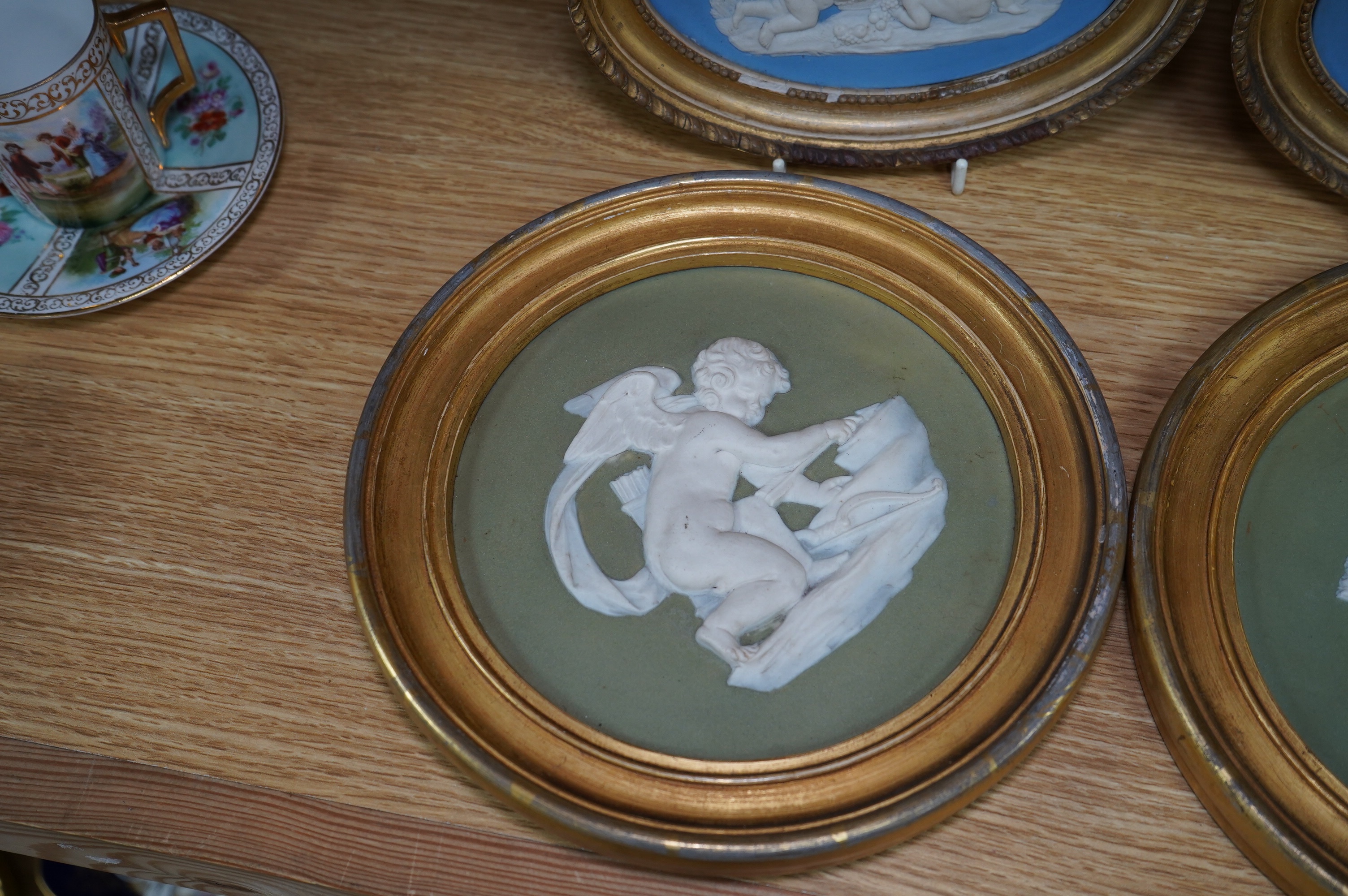 Two pairs of jasperware plaques, probably Wedgwood, in gilt frames, largest 19cm in diameter. Condition - fair to good